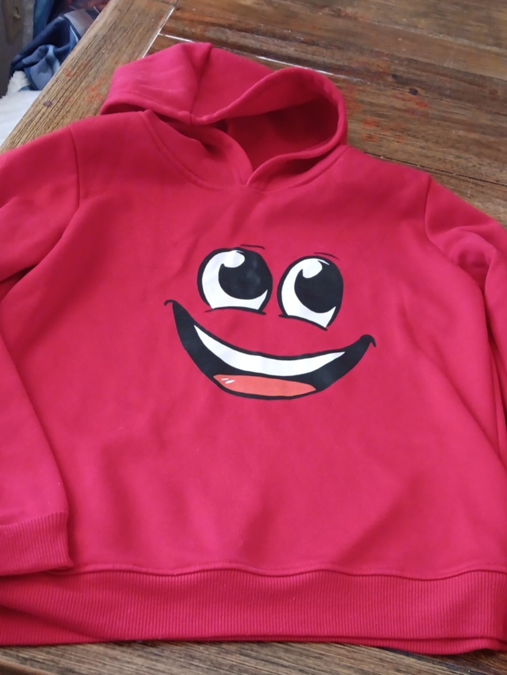 Unisex Red Hoodie with Smiley Face Graphic